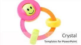  Presentation with infant - Amazing PPT theme having colorful smiley infant rattle backdrop and a  colored foreground