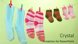  Presentation with colorful impressionist style artistic color - Beautiful PPT theme featuring colorful socks hanging on clothesline backdrop and a mint green colored foreground