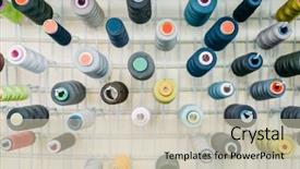  Presentation with thread - Presentation theme featuring colorful threads on spools closeup background and a soft green colored foreground