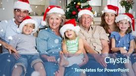  Presentation with falling snow - Theme with composite image of family in santa hats celebrating christmas against snow falling background and a ocean colored foreground