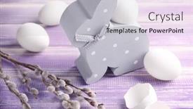  Presentation with eggshell - PPT theme featuring composition of easter eggs rabbit eggshell and willow branch on wooden table background and a light gray colored foreground