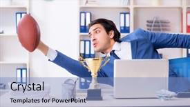  Presentation with motivation ball hill businessman - Colorful slide set enhanced with computer award - young handsome businessman with rugby backdrop and a light blue colored foreground