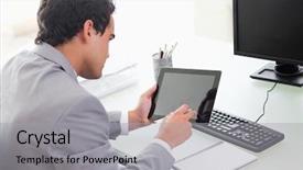  Presentation with tablet - Slide set enhanced with computer tablets - young businessman looking at his background and a light gray colored foreground