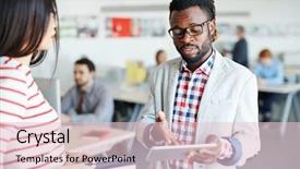  Presentation with attention - Colorful slide set enhanced with concentrated afro-american businessman in eyeglasses holding digital tablet in hand and pointing at something on its screen his female colleague listening to him with attention backdrop and a lemonade colored foreground