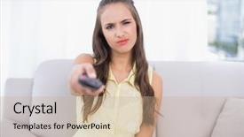  Presentation with global laptops remote - Colorful presentation theme enhanced with confusion free - frowning pretty brunette holding remote backdrop and a  colored foreground