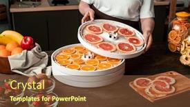  Presentation with orange fruit - PPT theme featuring contemporary-housewife-standing-by-kitchen background and a tawny brown colored foreground