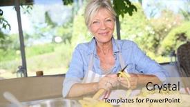  Presentation with homemade pastry apple pie pies - Presentation with cooking fun - senior woman cutting apples background and a  colored foreground