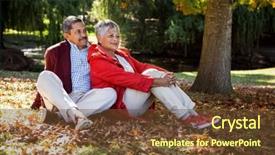  Presentation with mature students sitting at desks - PPT theme featuring couple sitting on autumn leaves background and a tawny brown colored foreground