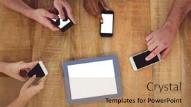  Presentation with team working together - Theme enhanced with creative team working together on a tablet and smartphones in casual office background and a coral colored foreground