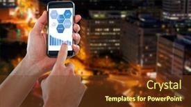  Presentation with city roads - Beautiful presentation theme featuring cropped hand using mobile phone against illuminated roads by buildings in city backdrop and a tawny brown colored foreground