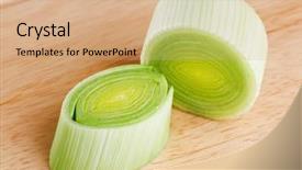  Presentation with cross - Presentation having cross-section of green leek on wooden chopping board background and a coral colored foreground