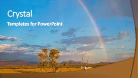  Presentation with sky rainbow - Presentation theme having crosses the sky over desert background and a teal colored foreground