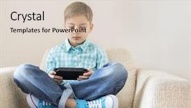  Presentation with video game - Cool new presentation theme with boy playing hand-held video backdrop and a lemonade colored foreground