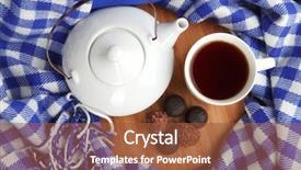  Presentation with teapot - Presentation enhanced with cup and teapot with candies on wooden stand on fabric background background and a tawny brown colored foreground