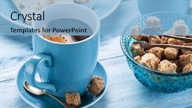  Presentation with cup cake - Presentation theme having cup of coffee milk jug cane sugar cubes and fruit-cake on old blu wooden table background and a light blue colored foreground