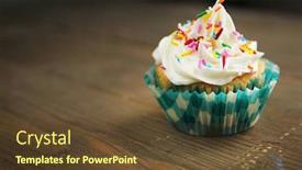  Presentation with cupcake - PPT theme featuring cupcake with candies in a checkered paper on a wooden table background and a tawny brown colored foreground