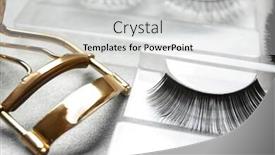  Presentation with eyelashes - Audience pleasing theme consisting of curler and false eyelashes on table backdrop and a light gray colored foreground