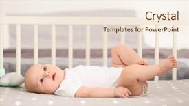  Presentation with cute baby - PPT theme consisting of cute baby lying in crib background and a sky blue colored foreground