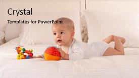  Presentation with baby toy - Colorful theme enhanced with note book for taking notes with a pen isolated on white note shallow depth of field backdrop and a gray colored foreground