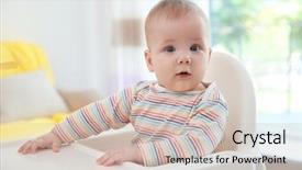  Presentation with baby sitting - PPT theme having cute baby sitting in kitchen background and a soft green colored foreground