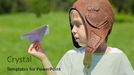  Presentation with pilot - Amazing presentation theme having cute boy in the old helmet pilot playing with paper plane backdrop and a tawny brown colored foreground