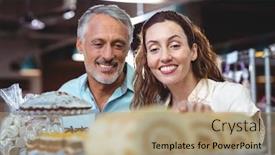  Presentation with cute bakery - Audience pleasing slide deck consisting of cute couple looking at cakes in the bakery store backdrop and a coral colored foreground