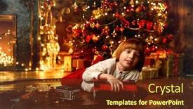  Presentation with railway - Cool new PPT layouts with cute five-year-old boy playing with a toy railway near the christmas tree christmas night christmas decoration backdrop and a tawny brown colored foreground