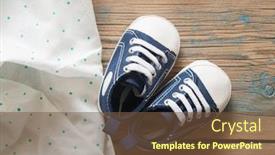  Presentation with baby shoes - Slide set consisting of cute little baby shoes on green polka dot background top view background and a tawny brown colored foreground