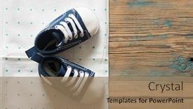  Presentation with baby shoes - Colorful slide set enhanced with cute little baby shoes on green polka dot background top view backdrop and a coral colored foreground