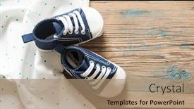  Presentation with baby shoes - Slide deck having cute little baby shoes on green polka dot background top view background and a coral colored foreground