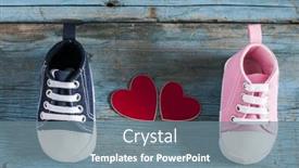  Presentation with baby shoes - Colorful presentation design enhanced with cute little baby shoes on wood background top view backdrop and a seafoam green colored foreground