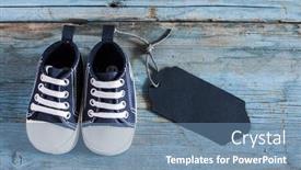  Presentation with baby shoes - Presentation theme having cute little baby shoes on wood background top view background and a seafoam green colored foreground