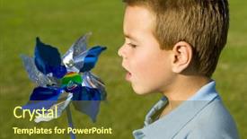  Presentation with pinwheel - Slide deck featuring wind energy close up portrait - cute little boy blowing background and a tawny brown colored foreground