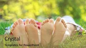  Presentation with feet - PPT theme enhanced with feet of cute little children lying on green grass in park background and a coral colored foreground
