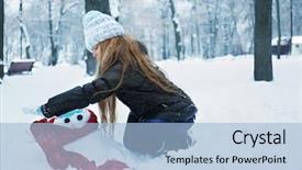  Presentation with snowman - Colorful presentation theme enhanced with cute little girl making snowman in winter park backdrop and a light blue colored foreground