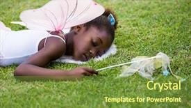  Presentation with fairy - Audience pleasing theme consisting of cute mixed-race girl wearing a fairy dress and sleeping on grass on a park backdrop and a tawny brown colored foreground