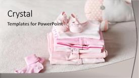  Presentation with baby toy - Presentation having cute pink - set of baby clothes background and a lemonade colored foreground