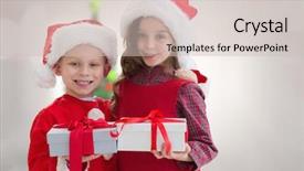  Presentation with siblings - PPT theme enhanced with cute siblings with gifts against blurry christmas tree in room background and a soft green colored foreground