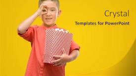  Presentation with child eye - Cool new PPT layouts with dark haired little child eating popcorn with happy face smiling doing ok sign with hand on eye looking through fingers backdrop and a gold colored foreground