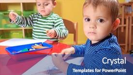  Presentation with toddlers - Audience pleasing PPT theme consisting of day care - cute european toddlers drawing backdrop and a ocean colored foreground