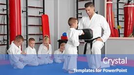  Presentation with children training on computers - Slide deck with defence - male karate instructor training little background and a teal colored foreground