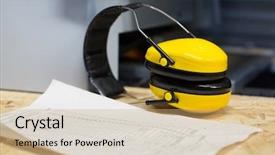  Presentation with personal protective equipment safety glasses - Presentation theme enhanced with ear defenders - industrial protective equipment concept background and a  colored foreground