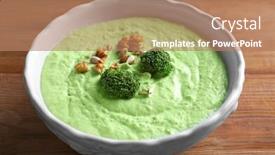  Presentation with walnut - Beautiful slide deck featuring delicious creamy broccoli soup with walnut in bowl on wooden background backdrop and a coral colored foreground