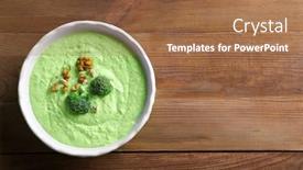  Presentation with walnut - Beautiful slide deck featuring delicious creamy broccoli soup with walnut in bowl on wooden background backdrop and a coral colored foreground
