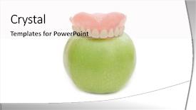  Presentation with dentures - PPT layouts having dental geriatri - dentures with green apple isolated background and a white colored foreground