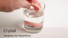  Presentation with dental prosthesis - Colorful slides enhanced with dental prosthesis - human hand removes false teeth backdrop and a soft green colored foreground