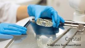  Presentation with dental laboratory - Cool new theme with dentist femele hands holding removable orthodontic teeth alignment correction trainer appliance in dental clinic laboratory equipment medicine and science stomatology and healthcare concept backdrop and a light gray colored foreground