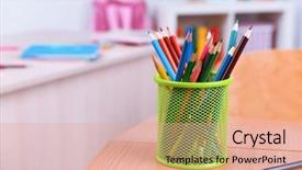  Presentation with crayons - Cool new PPT theme with desktop with cup of crayons backdrop and a coral colored foreground