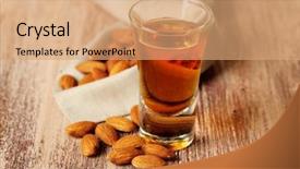  Presentation with liqueur - Presentation theme having dessert liqueur amaretto with almond background and a coral colored foreground