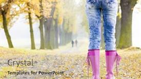  Presentation with rubber - Theme with detail of woman wearing rubber boots in autumnal alley background and a soft green colored foreground